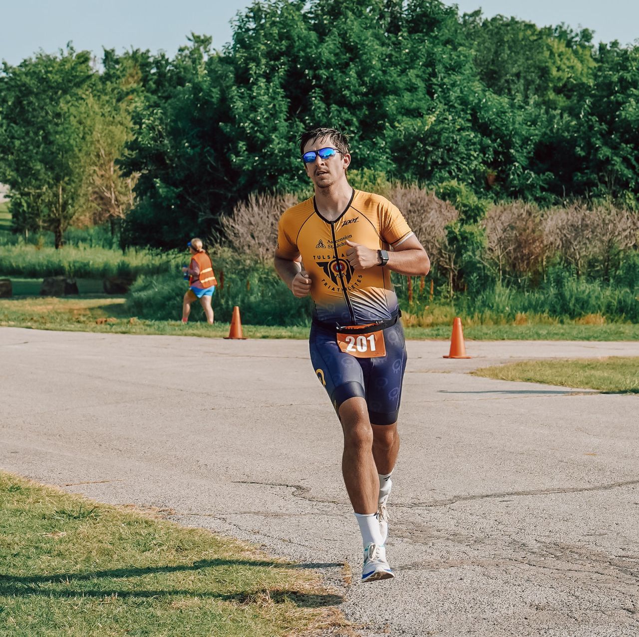 Alex running during a triathlon